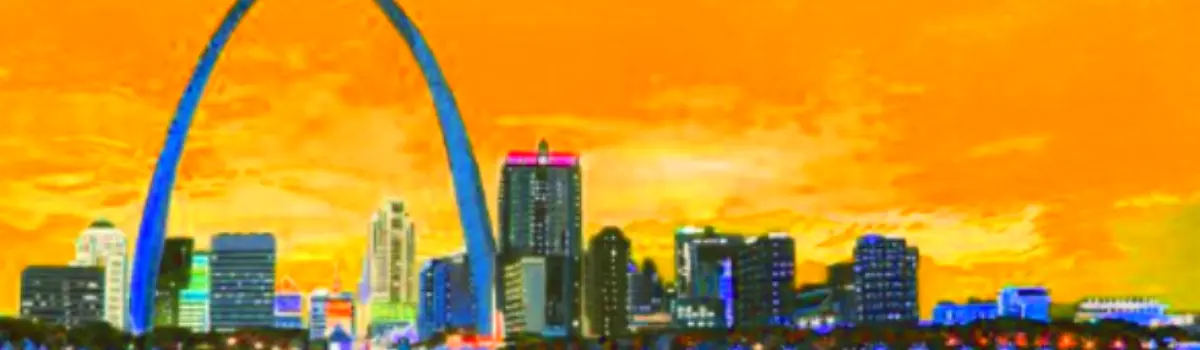Distorted skyline of Saint Louis with arch in the background with a orange hue for the sky.