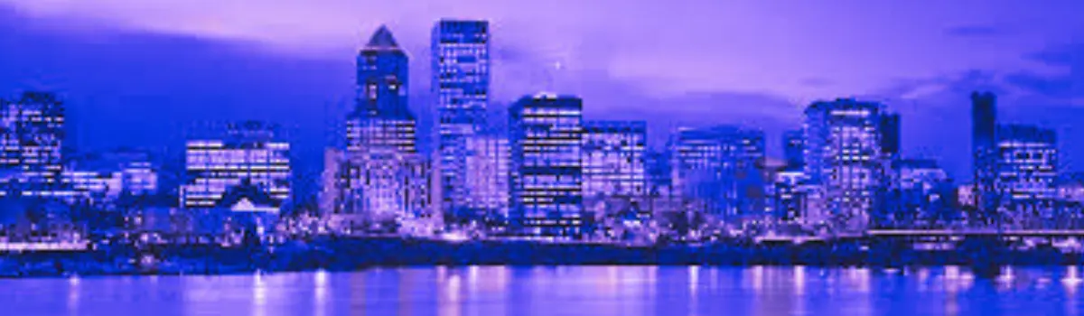 Blue and purple hues distorting the Portland, Oregon skyline with Willamette Rive in the foreground.